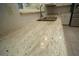 Close up of kitchen counter showing granite counters, tile back splash, and stainless steel sink at 687 N Endeavour Dr, Winter Springs, FL 32708