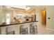 Modern kitchen with white cabinets, stainless steel appliances, and a bar top with seating at 687 N Endeavour Dr, Winter Springs, FL 32708