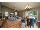 Open-concept living area with wood floors and sliding glass doors leading to a pool at 687 N Endeavour Dr, Winter Springs, FL 32708