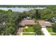 Aerial view of the home and backyard oasis with lake access at 7852 Broken Arrow Trl, Winter Park, FL 32792