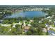 Stunning aerial view of the home situated near a picturesque lake at 7852 Broken Arrow Trl, Winter Park, FL 32792