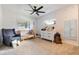 Cozy Bedroom featuring crib, glider, and playful decor at 7852 Broken Arrow Trl, Winter Park, FL 32792