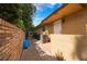 Exterior side view shows the clean landscape and additional side access to the home at 7852 Broken Arrow Trl, Winter Park, FL 32792