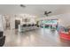 Spacious modern kitchen with island seating, stainless steel appliances, and access to the back patio at 7852 Broken Arrow Trl, Winter Park, FL 32792