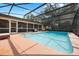 Enjoy the spacious screened-in pool with plenty of room to relax and unwind in the sun at 7852 Broken Arrow Trl, Winter Park, FL 32792