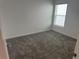Simple bedroom with plush carpeting, natural light, and neutral decor at 798 Kapi Dr, Groveland, FL 34736