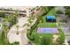 Aerial view of community featuring a playground, sports court, landscaped grounds, and gated entrance at 8024 Cool Breeze Dr # 132, Orlando, FL 32819