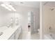 A view of a double sink bathroom that has access to the bedroom at 8024 Cool Breeze Dr # 132, Orlando, FL 32819