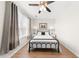 Neutral bedroom with a ceiling fan, cozy black accents and bright natural light at 8024 Cool Breeze Dr # 132, Orlando, FL 32819