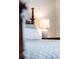 Close-up showcasing the comfortable pillow and detailed bedside lamp, highlighting the room's attention to detail at 8024 Cool Breeze Dr # 132, Orlando, FL 32819