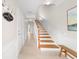 View of the foyer, stairs, and hallway in this well-lit home at 8024 Cool Breeze Dr # 132, Orlando, FL 32819