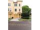 Charming two-story townhome features a private garage, a covered entryway, and well-maintained landscaping at 8024 Cool Breeze Dr # 132, Orlando, FL 32819