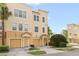 Well-maintained townhome with a private garage, tiled roof, and neatly landscaped front yard exuding charm at 8024 Cool Breeze Dr # 132, Orlando, FL 32819