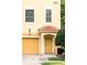Close up of the exterior of this charming two-story townhouse with a private garage at 8024 Cool Breeze Dr # 132, Orlando, FL 32819
