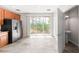 Bright kitchen featuring stainless steel appliances, tile floors and access to outdoor balcony at 8024 Cool Breeze Dr # 132, Orlando, FL 32819