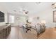 Bright and airy living room featuring hardwood floors, ceiling fan, neutral furniture and natural light at 8024 Cool Breeze Dr # 132, Orlando, FL 32819