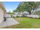 Lush backyard features a well-maintained lawn and a fenced perimeter at 8495 Lake Amhurst Trl, Orlando, FL 32829