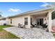 Charming backyard features a paved patio and lush lawn at 8495 Lake Amhurst Trl, Orlando, FL 32829