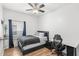 Cozy bedroom with desk, a ceiling fan, and plenty of natural light from the window at 8495 Lake Amhurst Trl, Orlando, FL 32829