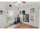 Cozy bedroom boasts wood-look flooring, ample natural light, and calming decor at 8495 Lake Amhurst Trl, Orlando, FL 32829
