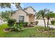 Charming home with a well manicured lawn, beautiful landscaping and a two-car garage at 8495 Lake Amhurst Trl, Orlando, FL 32829