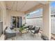 Inviting covered patio with string lights and comfortable seating at 8495 Lake Amhurst Trl, Orlando, FL 32829