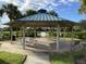 Relax in this community's pavilion with picnic tables, offering a perfect spot for gatherings and outdoor enjoyment at 8495 Lake Amhurst Trl, Orlando, FL 32829
