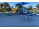 Community playground with blue, yellow, and red slides, providing a fun and safe environment at 8495 Lake Amhurst Trl, Orlando, FL 32829