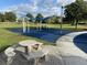Playground featuring swings, slides, a covered picnic area, and soft surfacing at 8495 Lake Amhurst Trl, Orlando, FL 32829