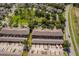 A high aerial view of townhome community displaying manicured landscaping and parking at 9140 Grey Moss Dr, Orlando, FL 32832