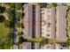 Aerial view of townhomes with a red outline indicating property lines, with allocated parking spaces at 9140 Grey Moss Dr, Orlando, FL 32832