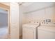 Laundry room with a washer and a dryer at 9140 Grey Moss Dr, Orlando, FL 32832