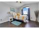 Bright bedroom featuring hardwood floors, vaulted ceiling, arch window with curtains, and decorative elements at 915 Lockbreeze Dr, Davenport, FL 33897