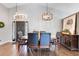Formal dining area with a stylish chandelier, perfect for hosting dinners and gatherings at 915 Lockbreeze Dr, Davenport, FL 33897