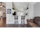 Open floor plan featuring kitchen with seating area overlooking the living room at 915 Lockbreeze Dr, Davenport, FL 33897