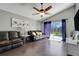 Bright living room with sliding glass doors opening to the pool area, offering seamless indoor-outdoor living at 915 Lockbreeze Dr, Davenport, FL 33897