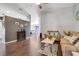 Cozy living room with wood floors, comfortable seating, and an electric fireplace, perfect for relaxation at 915 Lockbreeze Dr, Davenport, FL 33897