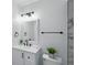 Updated bathroom with modern fixtures, a vanity with storage, and a towel rack at 1002 Cypress Ave, Sanford, FL 32771