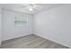 Bright bedroom featuring a ceiling fan and a window that offers natural light at 1002 Cypress Ave, Sanford, FL 32771