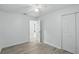 Neutral bedroom with a closet and an ensuite bathroom, featuring wood-look floors at 1002 Cypress Ave, Sanford, FL 32771