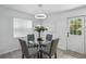 Inviting dining space featuring a round table, upholstered chairs, and modern lighting at 1002 Cypress Ave, Sanford, FL 32771
