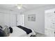 Bedroom with an ensuite bathroom and walk-in closet, decorated in a neutral color palette at 1002 Cypress Ave, Sanford, FL 32771