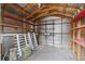 Interior of a shed with wooden beams, shelves, and storage space at 1002 Cypress Ave, Sanford, FL 32771