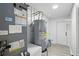 Clean utility room featuring water heater, flooring, and painted white walls at 1002 Cypress Ave, Sanford, FL 32771