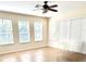 Bright living room with tile flooring, several windows, and neutral walls at 1016 Fountain Coin Loop, Orlando, FL 32828