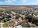 Wide aerial shot of home with pool outlined within property lines in neighborhood at 1031 Kings Hwy, Kissimmee, FL 34744