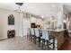 Modern kitchen with bar seating, granite countertops, and stylish light fixtures at 1031 Kings Hwy, Kissimmee, FL 34744