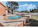 Private backyard pool surrounded by lush landscaping at 1031 Kings Hwy, Kissimmee, FL 34744
