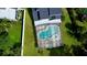 Aerial view of the private, screened-in pool and expansive yard at 10747 Satinwood Cir, Orlando, FL 32825
