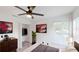 Bright bedroom features modern ceiling fan, closet, and neutral decor at 10747 Satinwood Cir, Orlando, FL 32825